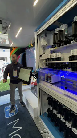 Pat Hernandez, a regional business development manager for PPG, demonstrates the capabilities of the MoonWalk automated paint mixing system at the SEMA Show in Las Vegas. Pat Hernandez, a regional business development manager for PPG, demonstrates the capabilities of the MoonWalk automated paint mixing system at the SEMA Show in Las Vegas.