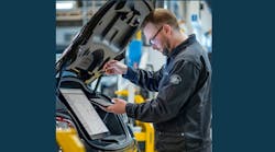 Technician with car Technician with car