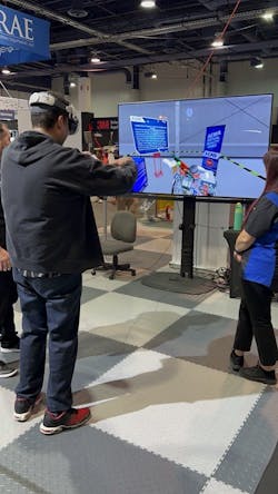 Abdulla Gaafarelkhalifa works virtually to de-energize a high-voltage EV battery at I-CAR's SEMA Show booth. Abdulla Gaafarelkhalifa works virtually to de-energize a high-voltage EV battery at I-CAR's SEMA Show booth.