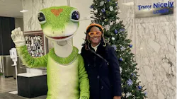 Mary Dixon stands next to GEICO mascot. Mary Dixon stands next to GEICO mascot.