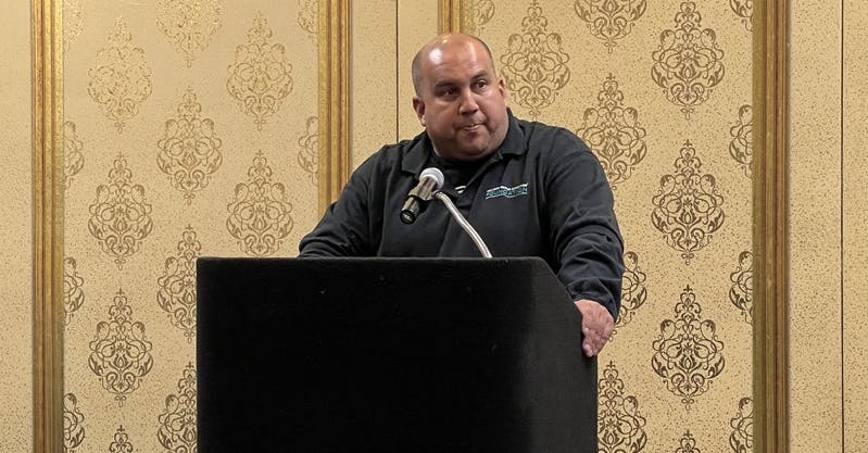 Ken Cook, an automotive instructor from L.A. County speaks about how he gets students interested in collision repair during the CREF Breakfast event during the SEMA Show in 2024.