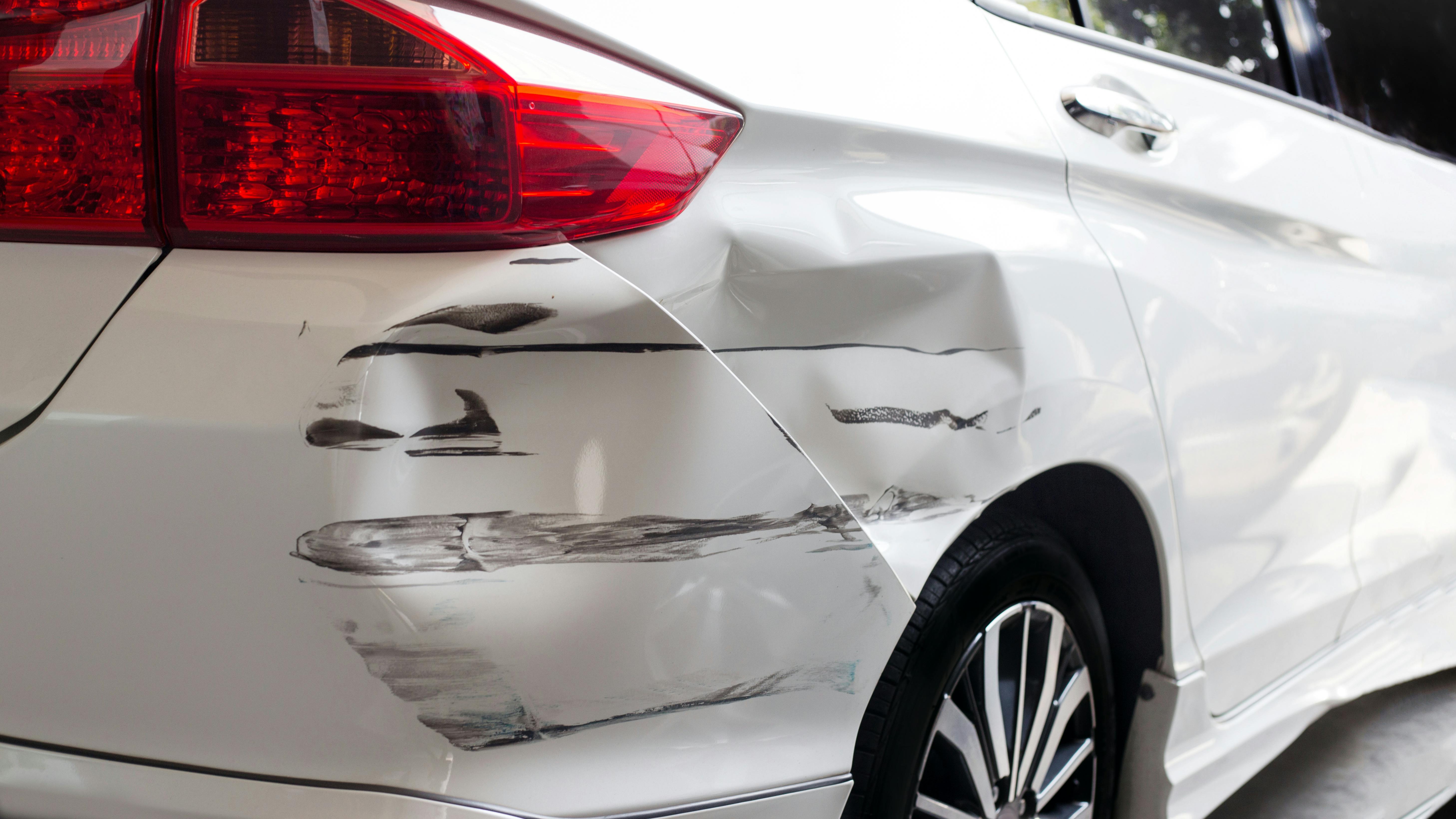 Collision-damaged vehicle, rear quarter