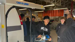 Students at Ogden High School gather to interact with the new Car-O-Liner resistance spot welder.