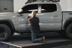 Dan Benton, Axalta refinish color marketing manager, uses a spectrophotometer to retrieve the Lunar Rock color on this 2021 Toyota as part of a 2023 demonstration held the week of the SEMA Show. Dan Benton, Axalta refinish color marketing manager, uses a spectrophotometer to retrieve the Lunar Rock color on this 2021 Toyota as part of a 2023 demonstration held the week of the SEMA Show.