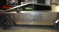 A 2024 Tesla Cybertruck on display at the Petersen Automotive Museum in Los Angeles in December 2023. The vehicle on display was shot with various weapons to demonstrate the strength of its exterior. Ballistics used included a .45 caliber 'Tommy Gun,' a 9mm Glock, a 9mm MP5-SD, and a 12-gauge shotgun. Five Tesla Cybertrucks at a Tesla Collision Center were damaged by fire and gunfire in Las Vegas on Tuesday, March 18.