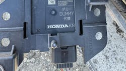 The OEM module on the right side of the vehicle had a part number of 682677200A. But look closely and see this is a nonfunctional 'dummy' unit. The OEM module on the right side of the vehicle had a part number of 682677200A. But look closely and see this is a nonfunctional 'dummy' unit.