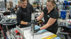 3M Application Engineer Specialist Ryan Marrinan observes a student applying a seam sealer bead at 3M's Skills Development Center. The Front Office Collision Repair Training Course begins next month.