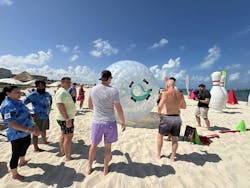Multiple teams gathered from Fix Network franchisees and executives from around the world for beach games. Multiple teams gathered from Fix Network franchisees and executives from around the world for beach games.