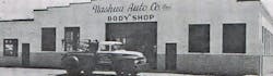 Nashua Auto Company was a Ford dealer in Nashua, New Hampshire. From the time this picture was taken in 1961, dealer body shops have been declining in number. Nashua Auto Company was a Ford dealer in Nashua, New Hampshire. From the time this picture was taken in 1961, dealer body shops have been declining in number.