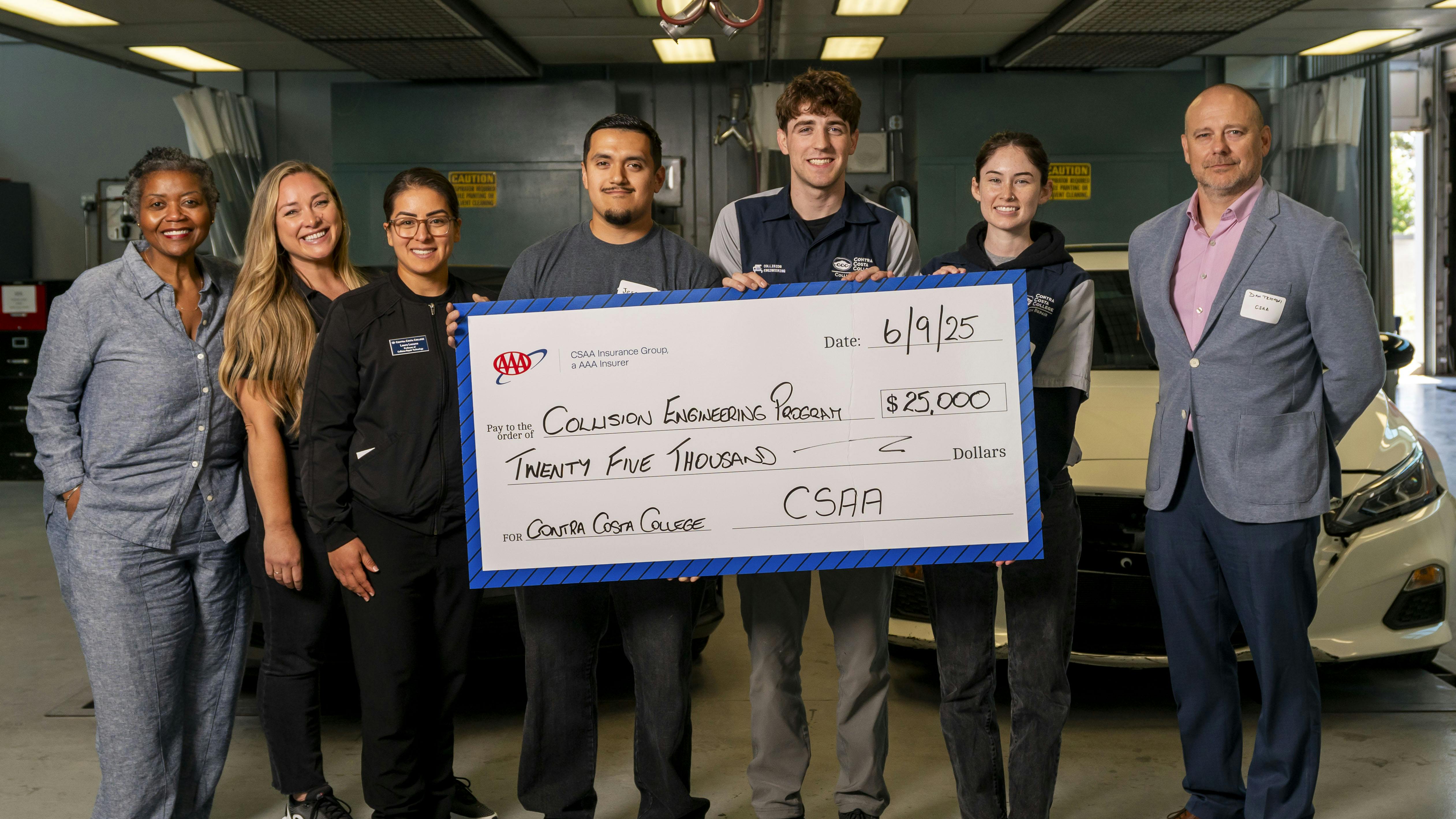Contra Costa College accepts a $25,000 donation to its collision engineering program from CSAA insurance group.
