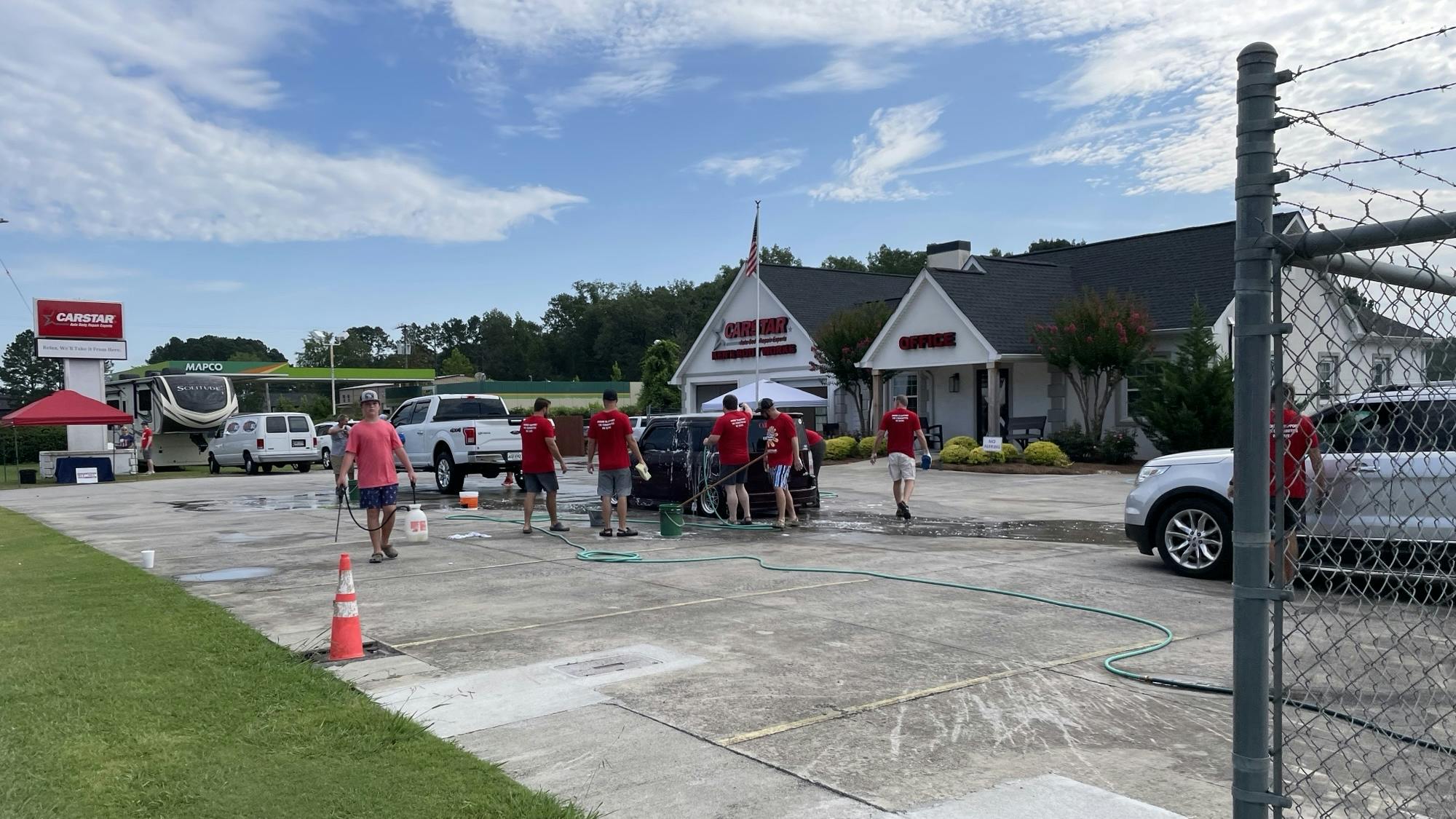 Ken's CARSTAR North's annual Soap It Up car wash raised about $1,800 for Cystic Fibrosis Foundation and the Miracle League of Whitfield County on July 12.