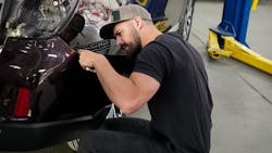 LEAD BY EXAMPLE: Showtime Collision Operator and Shop Manager Tyler Makeig assists with a fitment concern on a Subaru Outback. His hands-on leadership style is the foundation of the shop's culture. LEAD BY EXAMPLE: Showtime Collision Operator and Shop Manager Tyler Makeig assists with a fitment concern on a Subaru Outback. His hands-on leadership style is the foundation of the shop's culture.