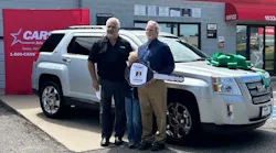 Michael Esler receives a 2012 GMC Terrain from the NABC Recycled Rides Program.