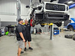 TECHNICIAN REVIEW: Barkley reviews the repair plan with the technician disassembling the vehicle, outlining key steps and each stage of the repair process. TECHNICIAN REVIEW: Barkley reviews the repair plan with the technician disassembling the vehicle, outlining key steps and each stage of the repair process.