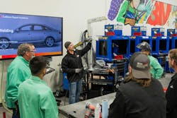 3M Senior Application Engineer Ryan Marrinan describes to attendees at the Skills Development Center how to prep practice coupons. 3M Senior Application Engineer Ryan Marrinan describes to attendees at the Skills Development Center how to prep practice coupons.