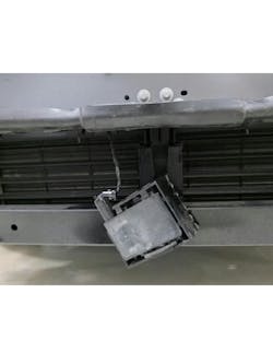 Figure 2: As can be seen easily with the bumper removed, damage that at first appeared to be very minor led to a direct shot to the front radar module. Figure 2: As can be seen easily with the bumper removed, damage that at first appeared to be very minor led to a direct shot to the front radar module.