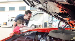 Sean and Bjorn Anton check out the interior of a car during the show.