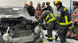 Members of the Seminole County, Maitland, and Winter Park Fire Departments participate in hands-on training as part of the National Auto Body Council on September 4 in Orlando, Florida.