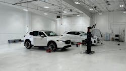 68f14f926f2d111336bbafb4 2whitecarsinshop1scaled 68f14f926f2d111336bbafb4 2whitecarsinshop1scaled