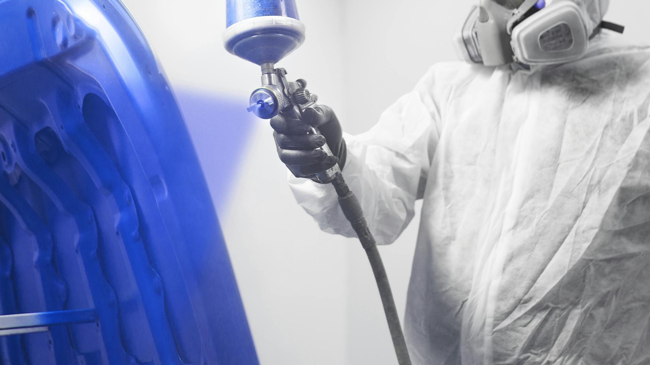 68fe7538093a7d3b22a74260 Painter Spraying Blue Hood Dreamstime L 153276356