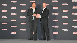 FenderBender Award winner Jon Sommers, right, accepts his award from FenderBender Editor-in-Chief Jay Sicht at the Red Carpet Awards event.