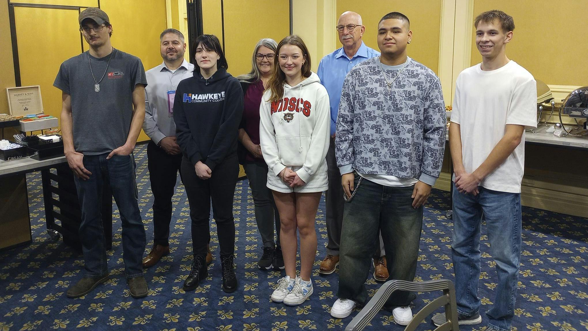 Back, from left: BASF's Phil Knapp, Tina Nelles, and John Shoemaker helped mentor the five Techs for Tomorrow winners William Tindall, Alexis Beckler, Isabella Roll, Rafael Luna, and Gavin Shoun during the SEMA Show in Las Vegas.