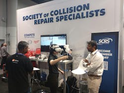 Alexis Beckler tries out Skillveri's mixed reality painting simulator at the Society of Collision Repair Specialists booth during the SEMA Show. Alexis Beckler tries out Skillveri's mixed reality painting simulator at the Society of Collision Repair Specialists booth during the SEMA Show.