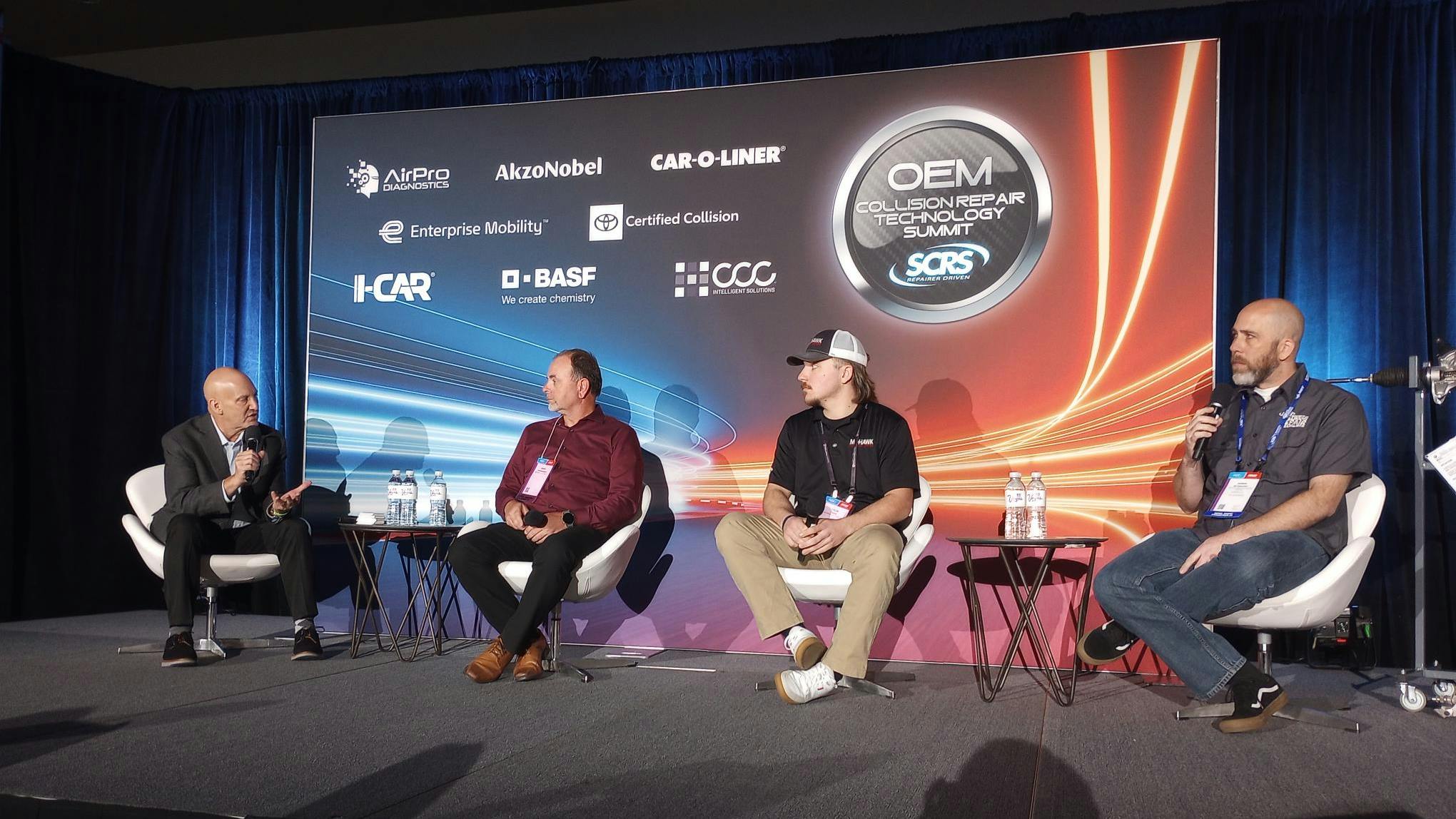 SAFETY FIRST Mike Anderson of CollisionAdvice.com, left, leads a panel discussion about steering gear and column safety inspections with Gerry Rosenbarker and Tyler Foote of Mohawk Collision Center and Andrew Batenhorst of Pacific BMW Collision Center at the OEM Collision Repair Technology Summit during the SEMA Show.