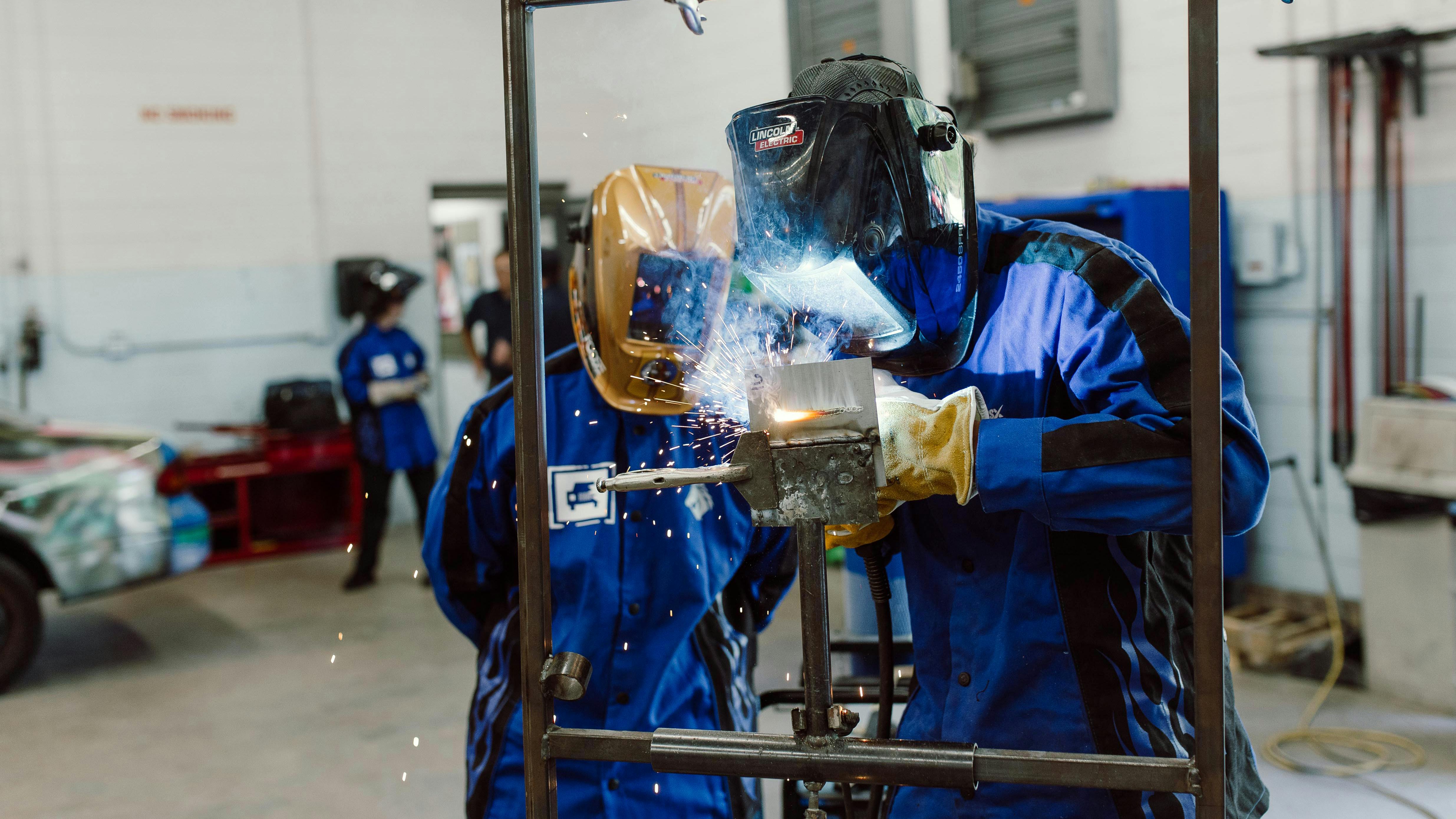STUDENT WELDER: A student gets hands-on instruction in welding at Sandhills Community College as part of the Collision Engineering Program that prepares students for successful careers in the industry.