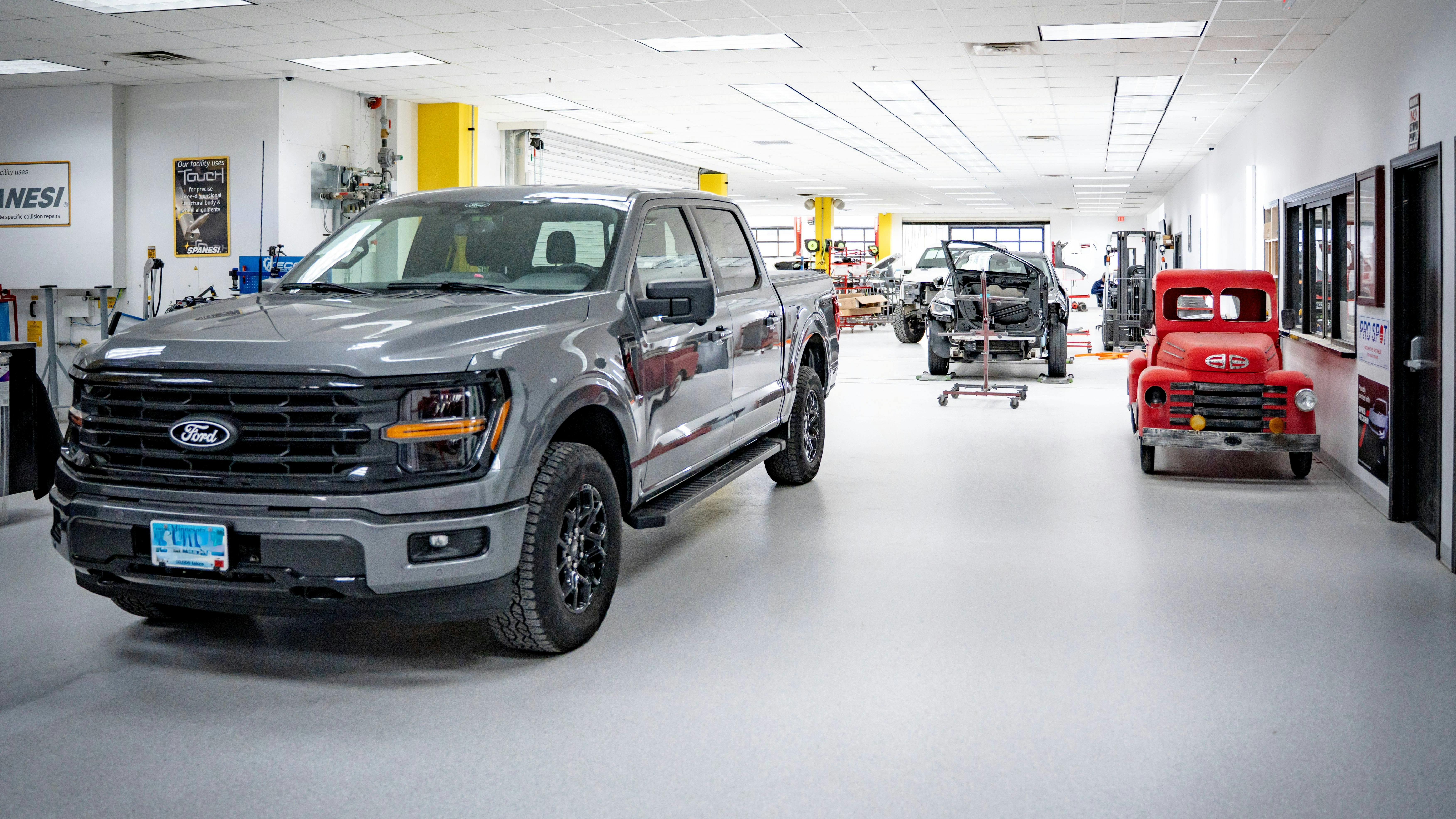 PRODUCTION ON THE MOVE: Shannon's Auto Body, in Brainerd, Minnesota, is approximately 39,000 square feet. Although a remodel of an existing building with many structural columns, Avant Garde was able to design a an open plan while minimizing wasted space.