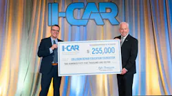 CREF Executive Director Brandon Eckenrode, left, accepts a donation from I-CAR President and CEO Kyle Thompson.