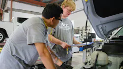 PRODUCTIVE APPRENTICESHIPS: At All County Collision, less-experienced team members, such as Aidan Richardson (r.) take on foundational tasks under close supervision.