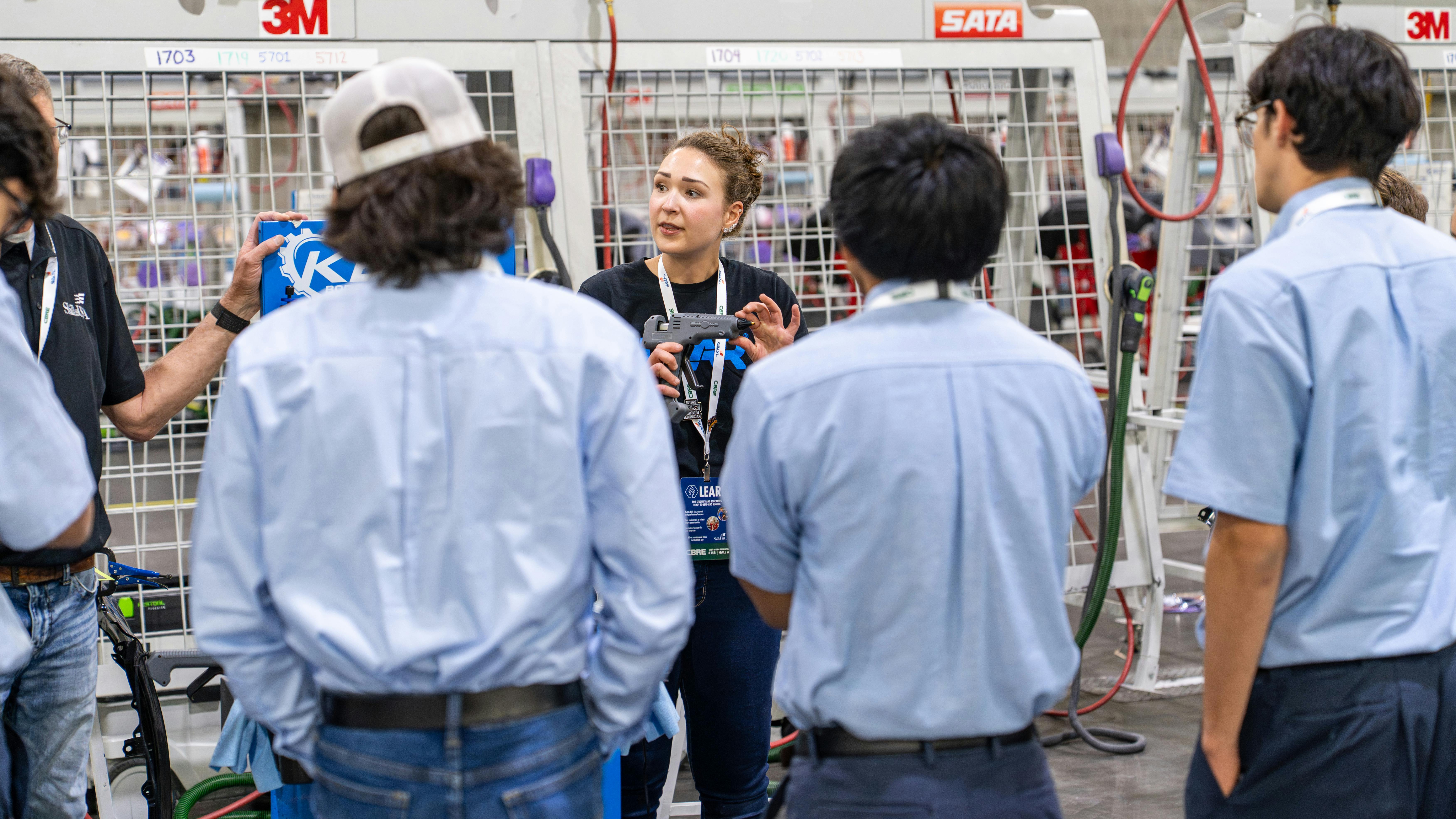 I-CAR Instructor Olivia Peterson engages students at the 2026 SkillsUSA I-CAR booth.