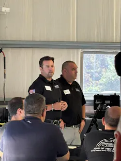 Revv's Joel Adcock speaks to the attendees about the United ADAS Collective.